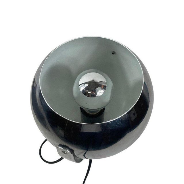 Chromed globe shaped table lamp mounted on a base. It can be adjusted on it’s bracket. In good shaped as you can see by...