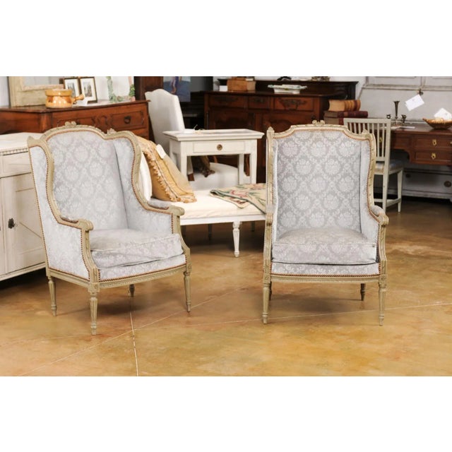 French Early 1900s French Louis XVI Style Bergères À Oreilles with Carved Motifs and Upholstery - A Pair For Sale - Image 3 of 12