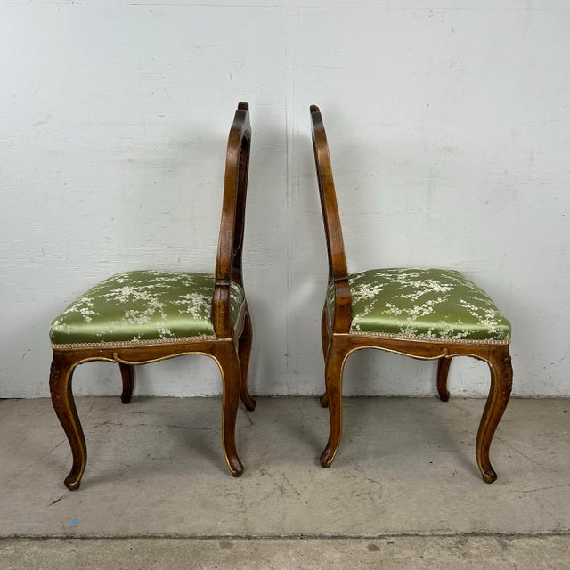 Elevate your dining or living space with this charming pair of French Provincial Louis XV-style side chairs. Featuring...