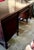 The dark brown desk has a luxurious and atmospheric appearance, exquisite and complex carved structure, low-key yet...