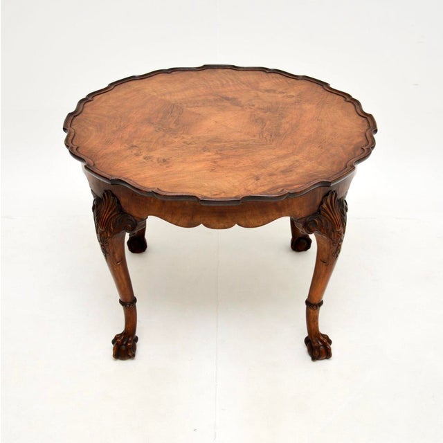 A fantastic antique figured walnut pie crust coffee table. This was made in England, it dates from the 1920’s. The quality...