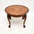 A fantastic antique figured walnut pie crust coffee table. This was made in England, it dates from the 1920’s. The quality...
