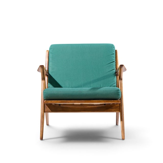 Poul Jensen for Selig Mid Century Walnut Z Lounge Chairs This chair measures: 29.75 wide x 33 deep x 28.5 high, with a...