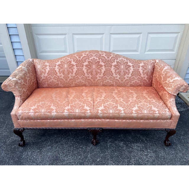 Peachy c1960s Hickory Chair Chippendale Settee. This is a beautiful camel back settee with mahogany ball and claw feet,...