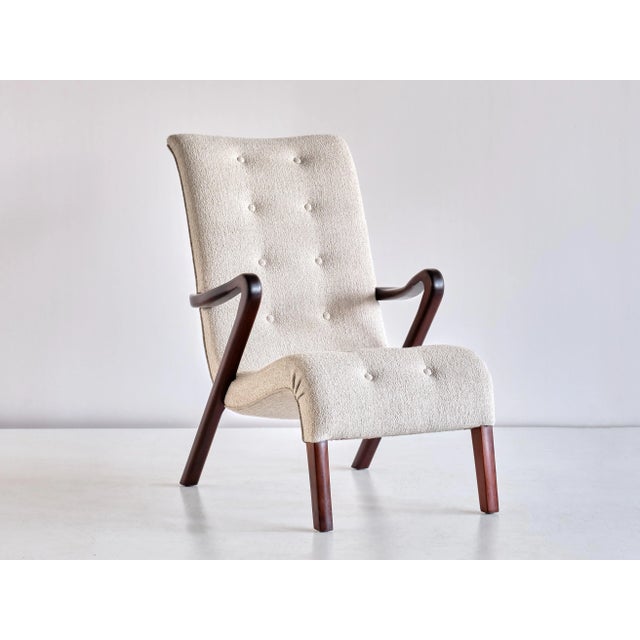This rare armchair was designed by Axel Larsson and produced in Sweden in the 1940s. The elegant and dynamic design is...