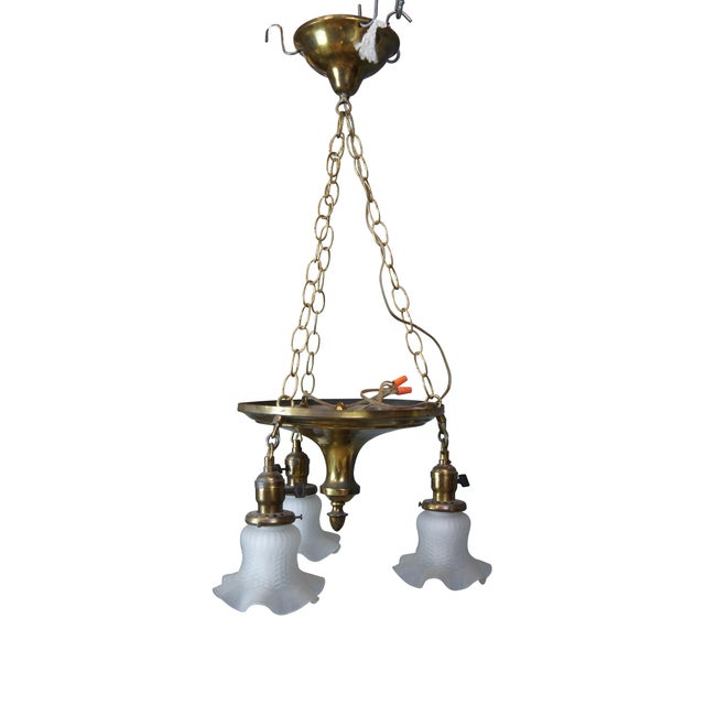 Antique drop light pendant chandelier. Made of brass featuring Victorian styling with three ruffled frosted / satin glass...