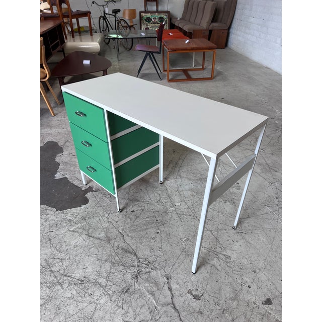 Steel frame mid century modern desk by George Nelson for Herman Miller, featuring newly lacquered drawers in a kelly green...