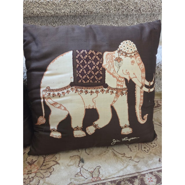 A pair of finest silk pillow covers with inserts. Design of an elephant by artist Jim Thompson. Image on both sides....