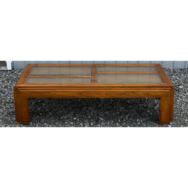 Beautiful coffee table circa 1960s featuring a signature mid-century modern silhouette with clean lines and stepped,...