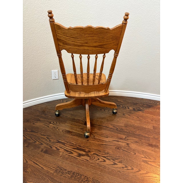 An exceptional H.W. Hull & Sons solid oak swivel desk chair, crafted in Gardena, California, and showcasing the quality...