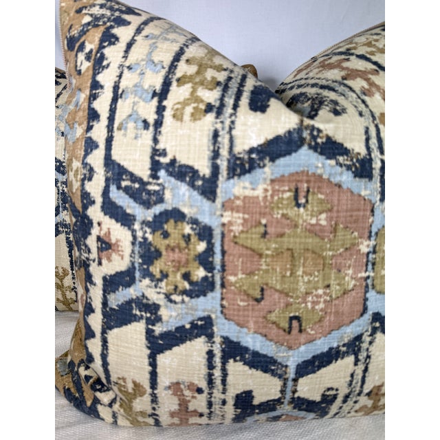 Custom pair of 22" pillows covered in GP & J Baker "Kilver" in color indigo and corded in a Samuel & Sons beige decorative...