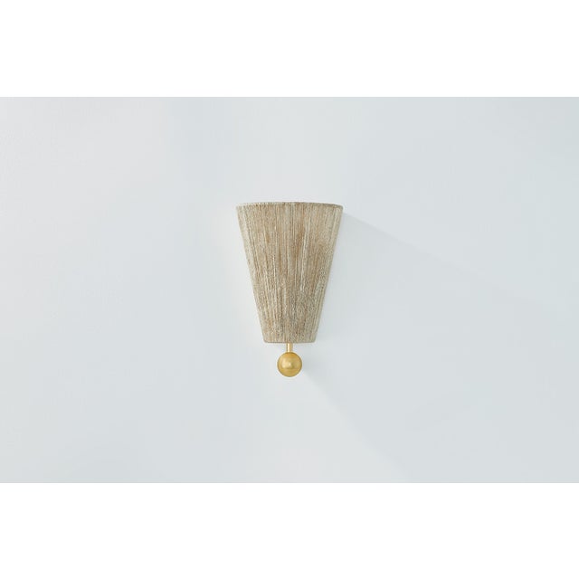 Opposites attract in the characterful Song. A light jute shade pairs with decorative Aged Brass spheres to create a...
