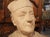 This terra cotta bust of a monsignor from Dinard, France is signed by the artist with the accompanying date of 1912. An...