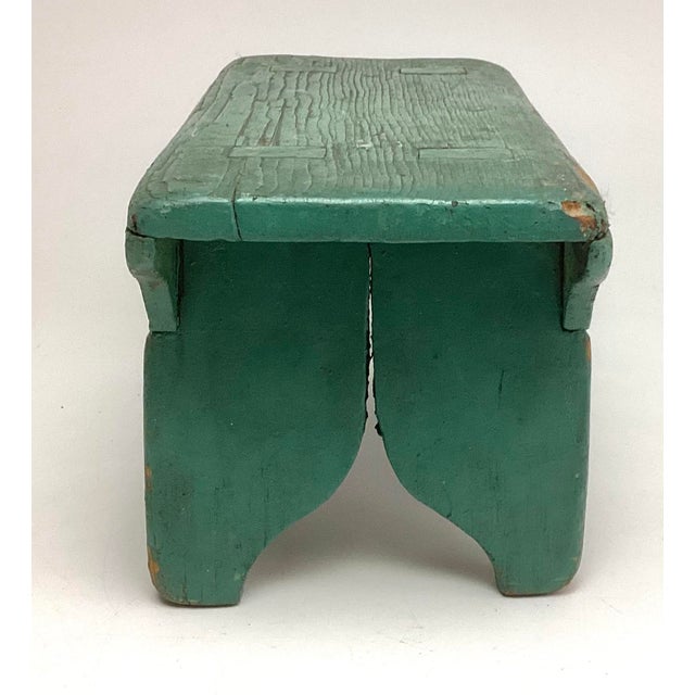 This primitive wood footstool carries all the character and honest wear collectors love. Finished in a beautifully...