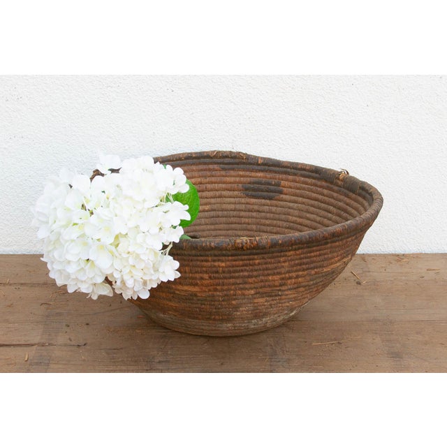 This incredibly weathered nomadic harvest vessel is a profound example of wabi-sabi beauty and historic utility. In...