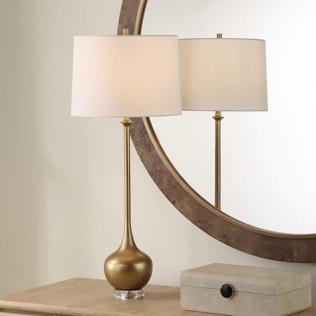 Elegant And Sophisticated, The Good As Gold Table Lamp Showcases A Golden Resin Base With Brushed Brass And Crystal...