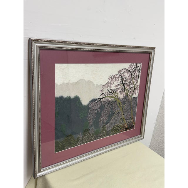 Design Plus Gallery presents an Embroidered Textile Landscape Wall Art from Vietnam. This framed textile artwork depicts a...