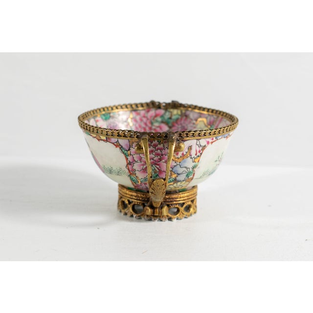 Beautiful Chinese Porcelain Cup, with a rich decoration of flowers and tree leaves all around the piece as well as...