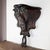 Striking antique 1900's Art Nouveau wall shelf carved from dark-stained wood, featuring flowing organic lines and an...