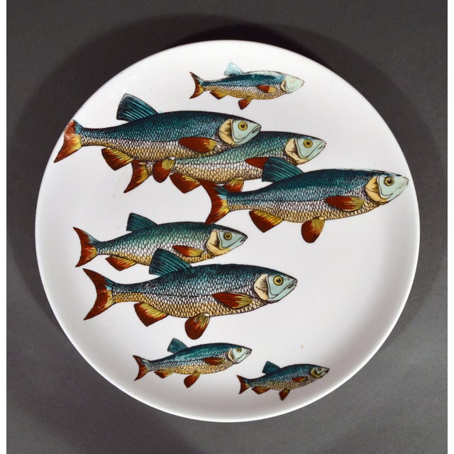 Piero Fornasetti Pesci Fish Plates, Numbers 2 and 3, a Pair This pair of plates comes from Piero Fornasetti’s Pesci series...