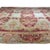 This circa 1840 French Antique Aubusson rug is a flat-woven tapestry piece featuring a vibrant red field with a soft blue...
