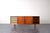 This teak sideboard was made in Denmark in the 60s. This piece of furniture has two sliding doors and two lockable doors....