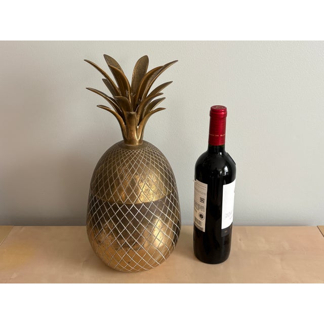 Add a touch of Hollywood Regency glamour to your bar or entertaining space with this stunning mid-century modern brass...