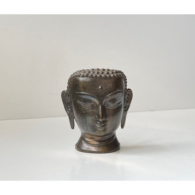 Offered as gifts to loyal buyers of Robert Laffont editions in the 1980s, this small patinated brass sculpture or candle...