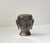 Offered as gifts to loyal buyers of Robert Laffont editions in the 1980s, this small patinated brass sculpture or candle...