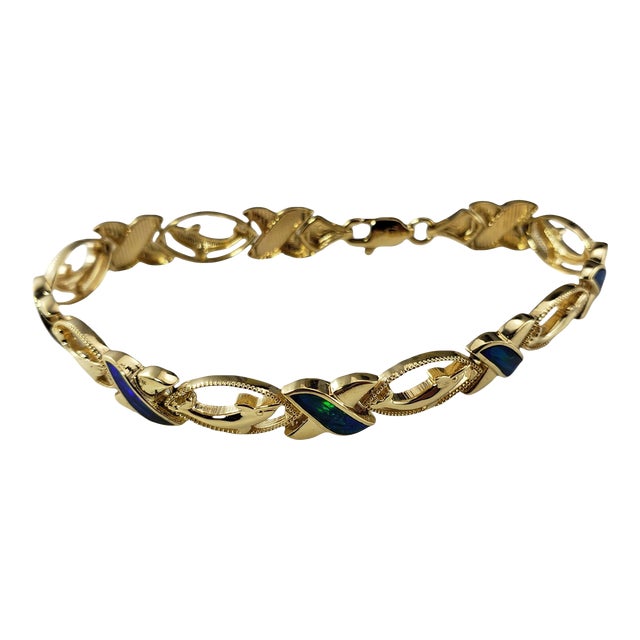 Mid 20th Century 14 Karat Yellow Gold & Black Opal Xo Dolphin Bracelet For Sale