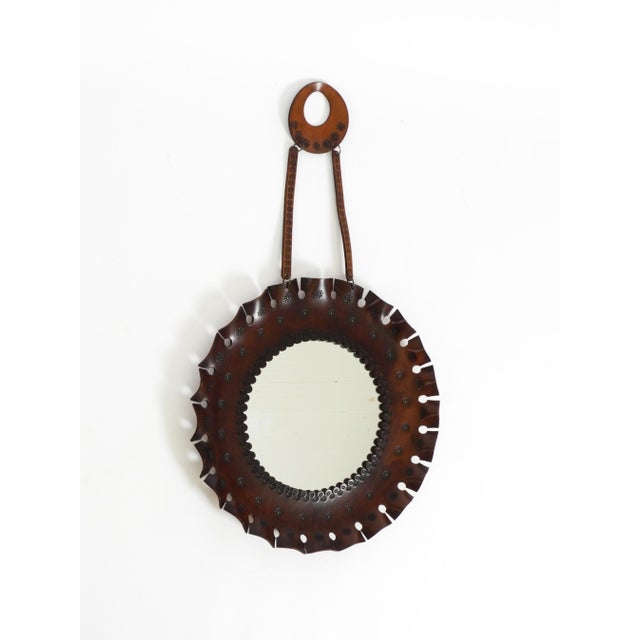 A beautiful, original 1960s round wall mirror featuring a wide frame and a leather hanging strap. The mirror's frame is...