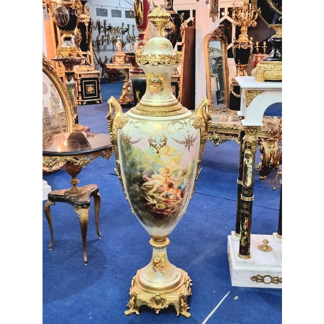 Bring timeless European elegance to your home with this exquisite decorative porcelain vase, featuring a luminous white...