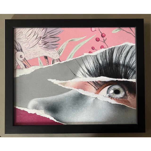 This artwork features a striking close-up of a human eye, partially obscured by a jagged tear that reveals a vibrant pink...