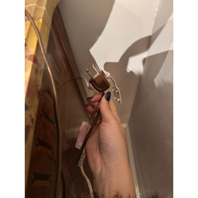 This is a vintage alabaster lamp in the form of a classical urn. It is carved with dramatic natural coloration ranging...