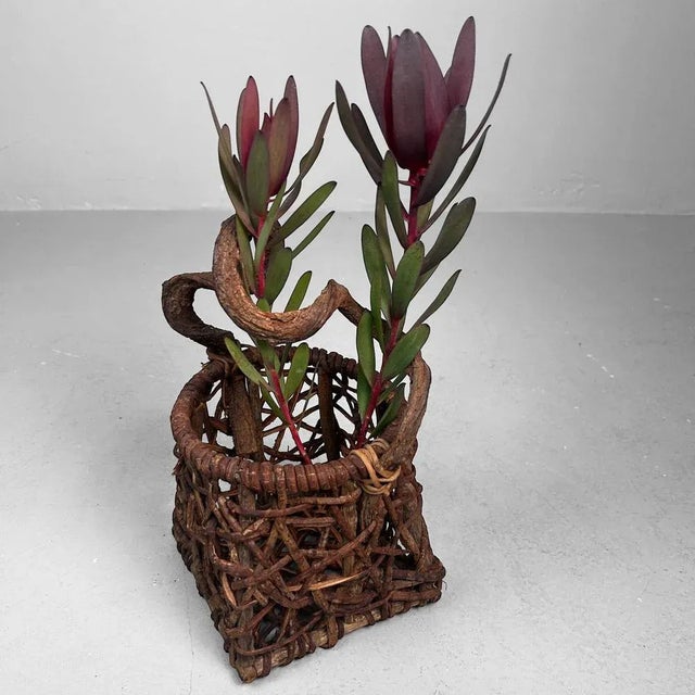 Exceptional Japanese hanakago (flower basket), crafted from naturally woven branches and vines, likely bamboo and...