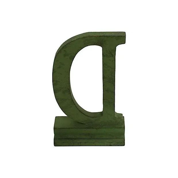 Vintage wood department store letter D in original green paint, found in Buffalo, NY.