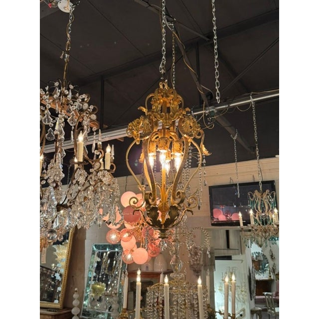 The French Gilt Bronze Lantern is a fine fixture that adds a touch of luxury. Beautiful scrolling details. Very nice!...