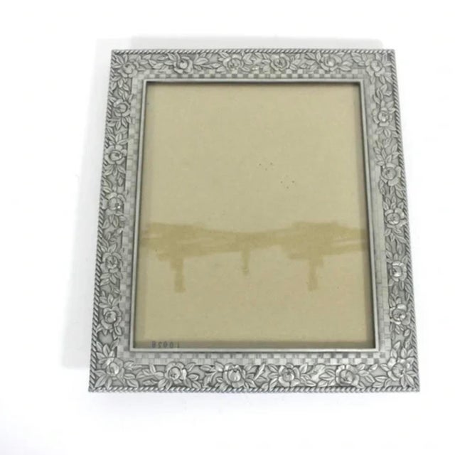 Large, very heavy vintage pewter rectangular frame with beautiful floral detail made by Seagull Pewter Canada. Easel back...