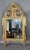 A charming early 19th century French giltwood mirror in the Louis XVI taste, distinguished by its refined carving and...