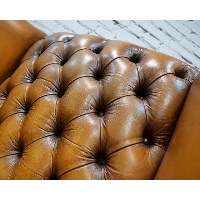 Original Chesterfield armchair, genuine Wingback, 1960s, England. Beautiful shadowed deep quilted natural leather,...