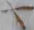 A nice pair of vintage sterling silver tongs with horn handles. The German tongs feature carved Horn handles with sterling...