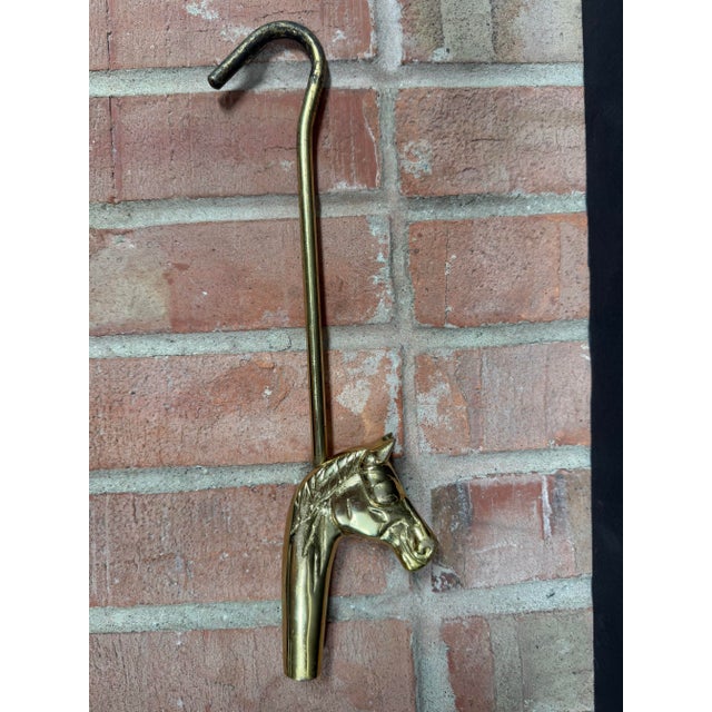 Stylish vintage brass horse head fireplace damper hook, circa 1980s. Perfect for the equestrian.