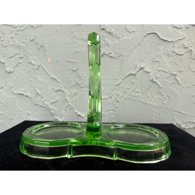 A striking Art Deco uranium glass creamer and sugar set with original caddy by Indiana Glass, produced during the...