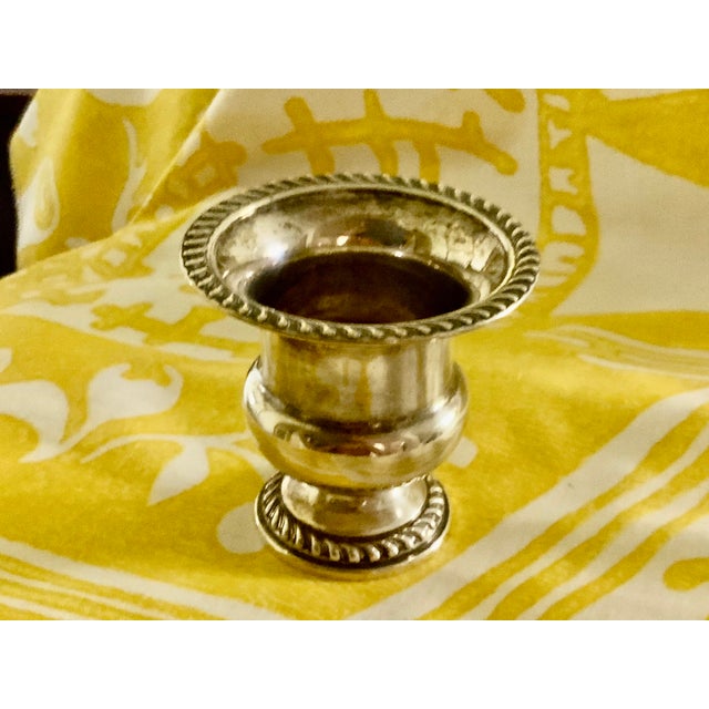 Elegant Sterling cigarette holder. Shaft and bulb form; with finely reticulated top and bottom edge.