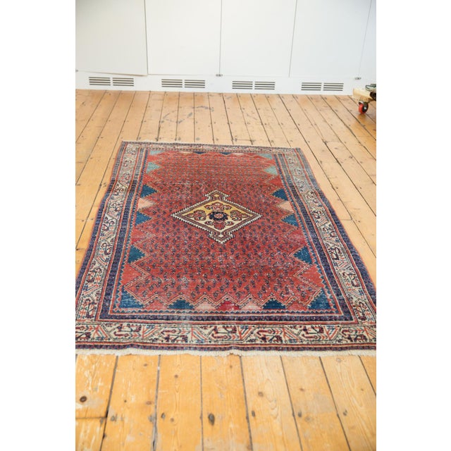 :: Diamond shaped center medallion atop a covered field of botehs. Outer floating framed zigzag design panels in un-...
