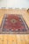 :: Diamond shaped center medallion atop a covered field of botehs. Outer floating framed zigzag design panels in un-...
