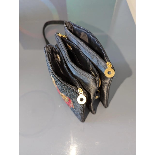 Beaded black satin bag with 3 compartments. The age is a guesstimate. The age range is from the 1940's to the 1980's. The...
