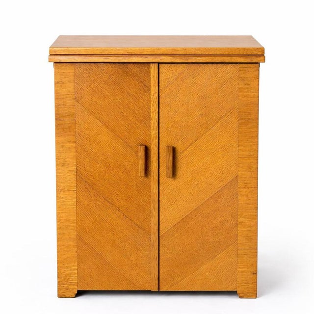An original antique oak sewing machine cabinet by Singer , complete with classic fold-out mechanism and beautifully simple...