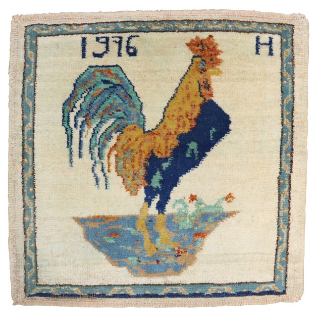 Vintage Turkishmat size rug depicting a rooster on an ivory field. Dated 1976 Measures: 1'10" x 2'.