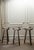 Set of three mid-century wooden bar stools with a sculptural Spanish Brutalist aesthetic. Crafted from exotic wood, each...